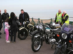 Geoff Booth is greeted by his wife and daughter at the seafront